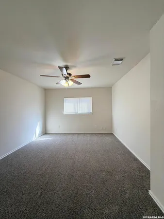 a view of empty room with windows