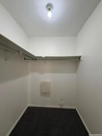 a view of a room with racks on the wall