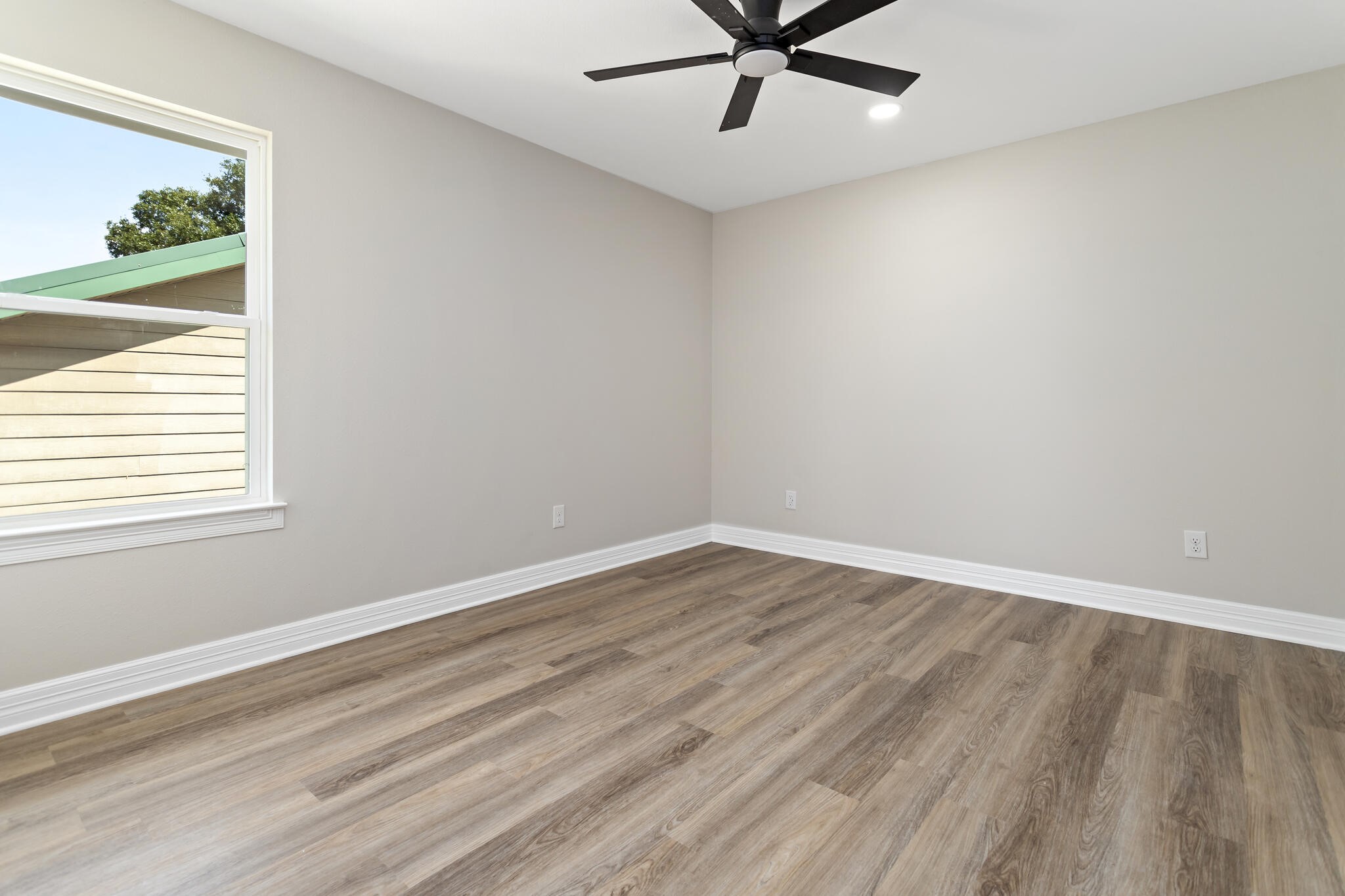 1813 Ordway Street Port Neches, TX 77651 - Photo 21 of 32 wooden floor in an empty room with a window