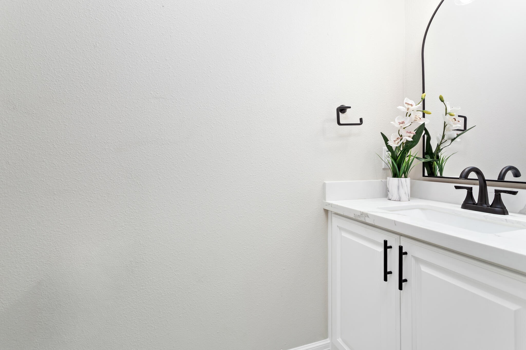 1813 Ordway Street Port Neches, TX 77651 - Photo 27 of 32 a bathroom with a sink and a mirror