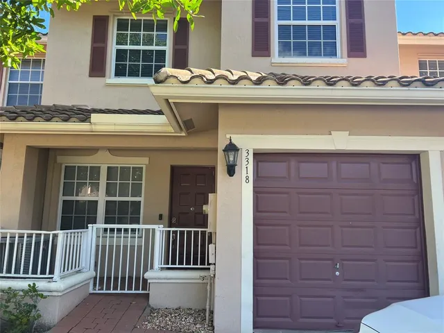 a view of a house with a tub and glass windows