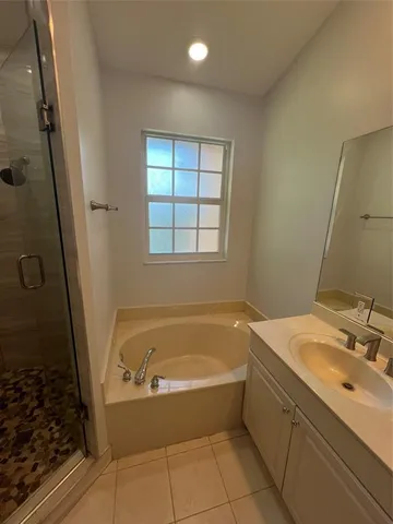 a bathroom with a bathtub and a sink