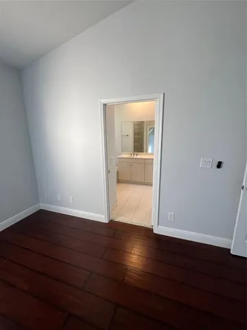 a view of wooden floor in an empty room