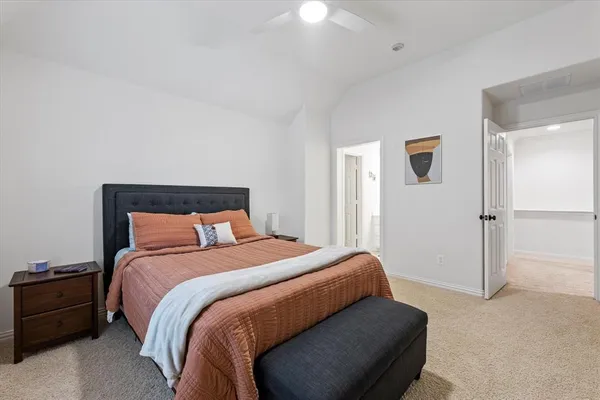 a bedroom with a bed and a cabinets