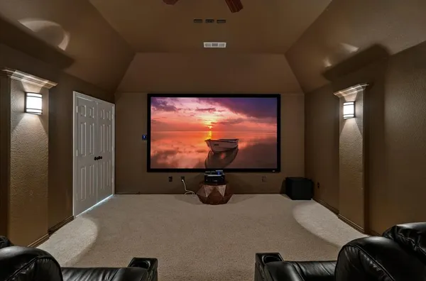 a livingroom with table and chairs with wooden floor
