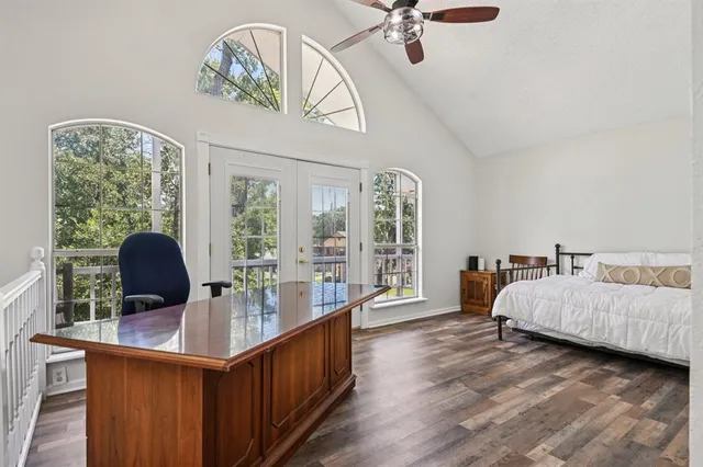 a living room with furniture and chandelier