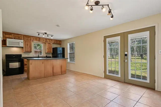 a large kitchen with a stove