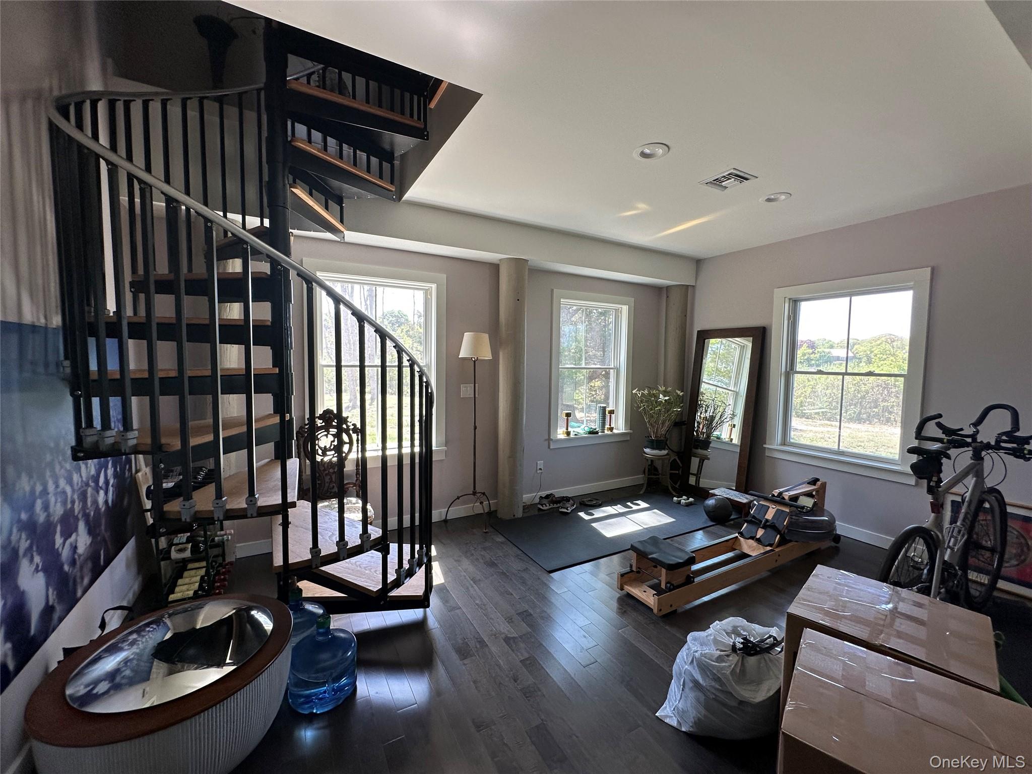 1854 North Bayview Road Southold, NY 11971 - Photo 12 of 20 Living room with wood finished floors, stairs, and recessed lighting
