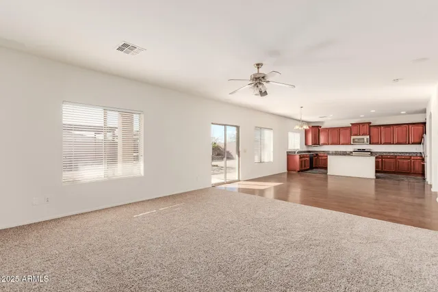 a kitchen with stainless steel appliances granite countertop a stove a sink a refrigerator and a oven