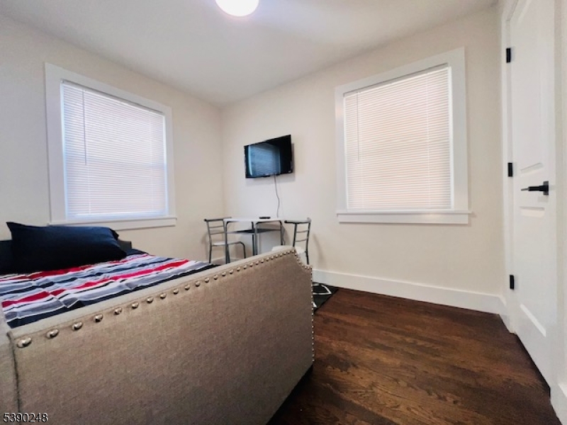 275 Valley Road Clark, NJ 07066 - Photo 6 of 14 a living room with furniture and a flat screen tv