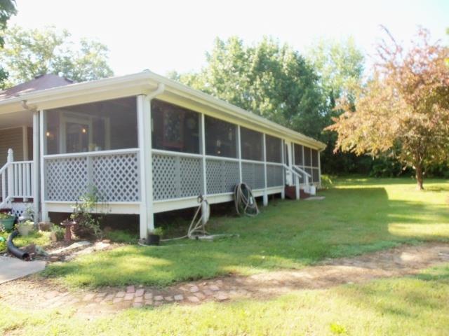 1556 Gratton Road Clarksville, TN 37043 - Photo 17 of 20 The screened in porch runs along the entire back of the home. The view from this porch is SO wonderful, and the best part is no need to worry about the bugs. Get the cold beverages and burgers out and ENJOY the view!!! Oh, and no backyard neighbors.