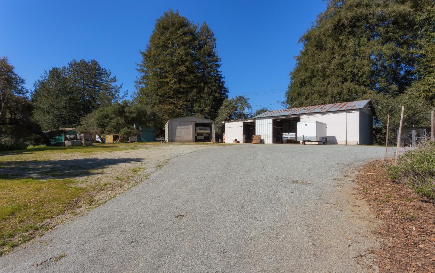 875 Calabasas Road Watsonville, CA 95076 - Photo 15 of 34 a front view of a house with a yard and trees