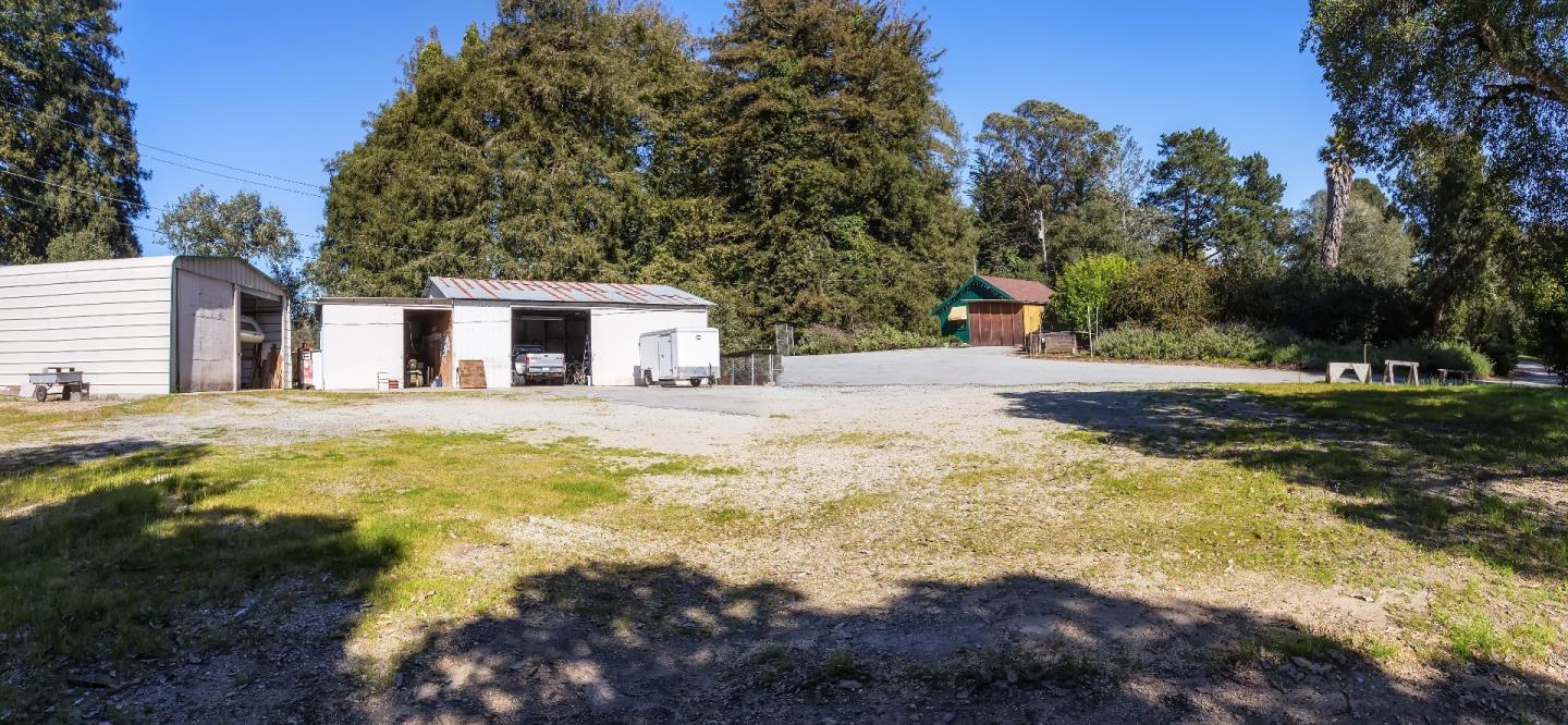 875 Calabasas Road Watsonville, CA 95076 - Photo 18 of 34 a swimming pool with yard and trees in the background