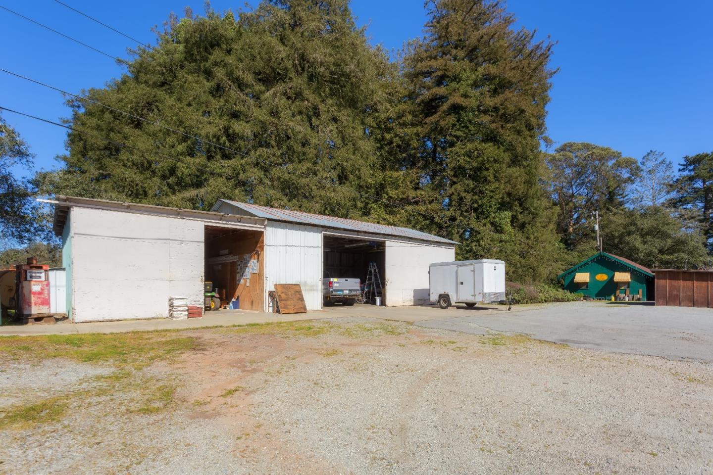 875 Calabasas Road Watsonville, CA 95076 - Photo 19 of 34 a view of a house with backyard and bushes