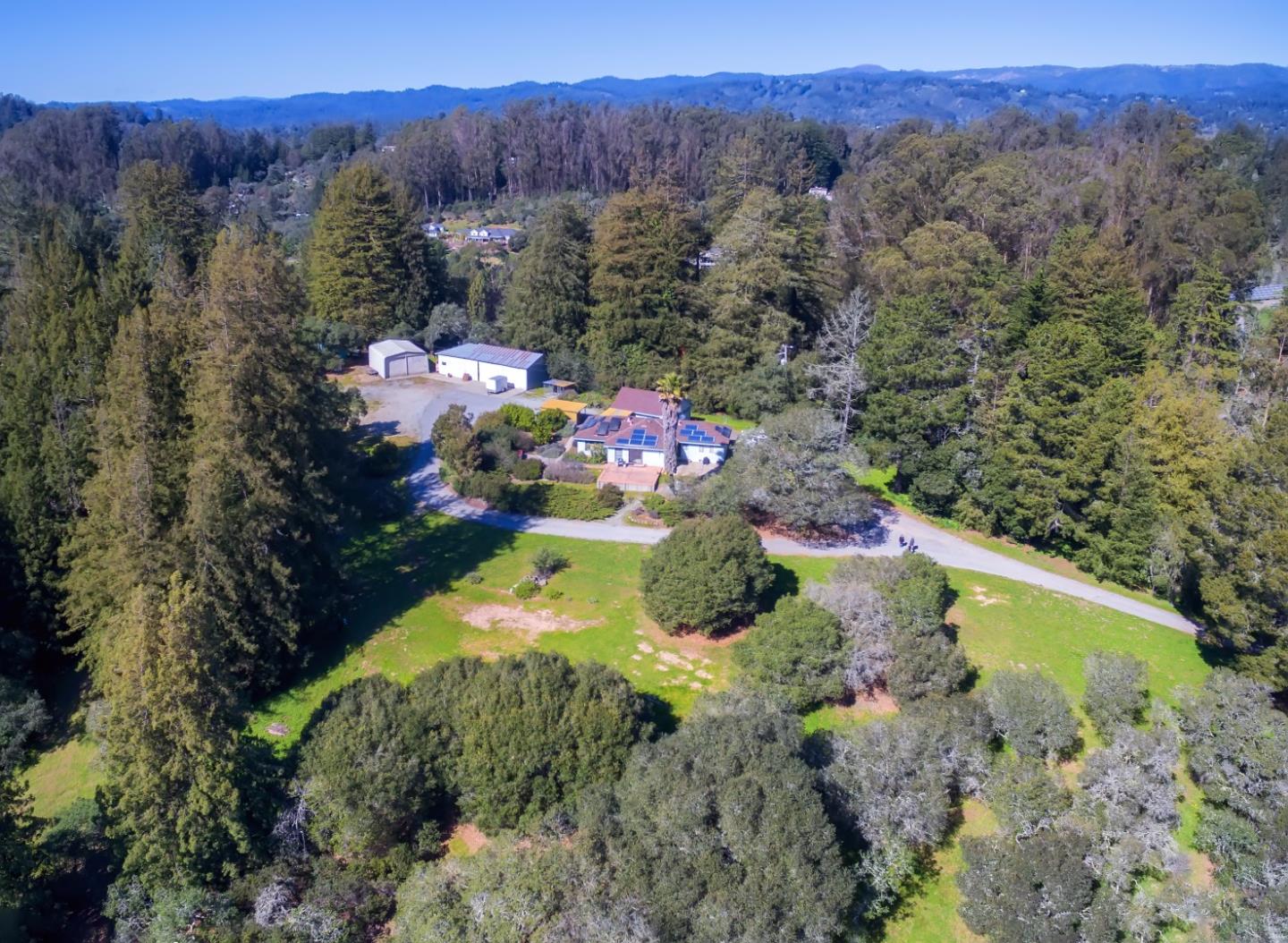 875 Calabasas Road Watsonville, CA 95076 - Photo 2 of 34 a view of a garden with mountains in the background