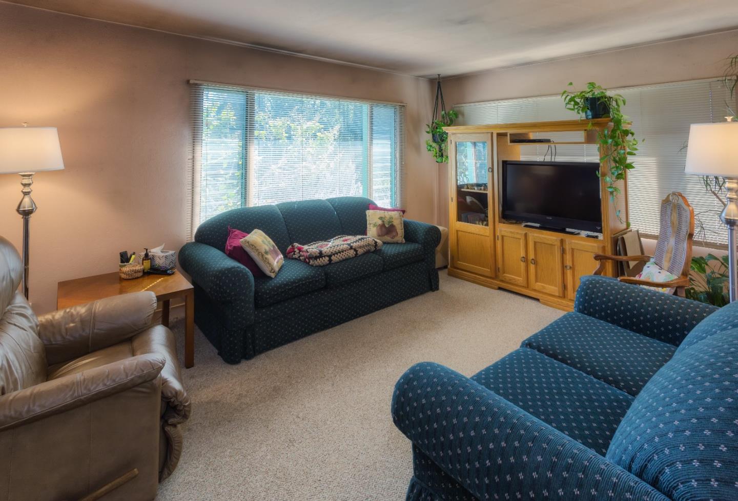 875 Calabasas Road Watsonville, CA 95076 - Photo 27 of 34 a living room with furniture and a flat screen tv