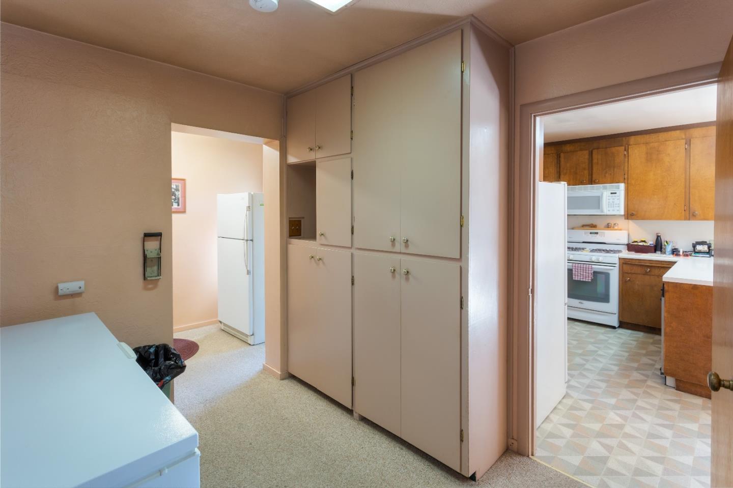 875 Calabasas Road Watsonville, CA 95076 - Photo 31 of 34 a view of a kitchen cabinets and a livingroom