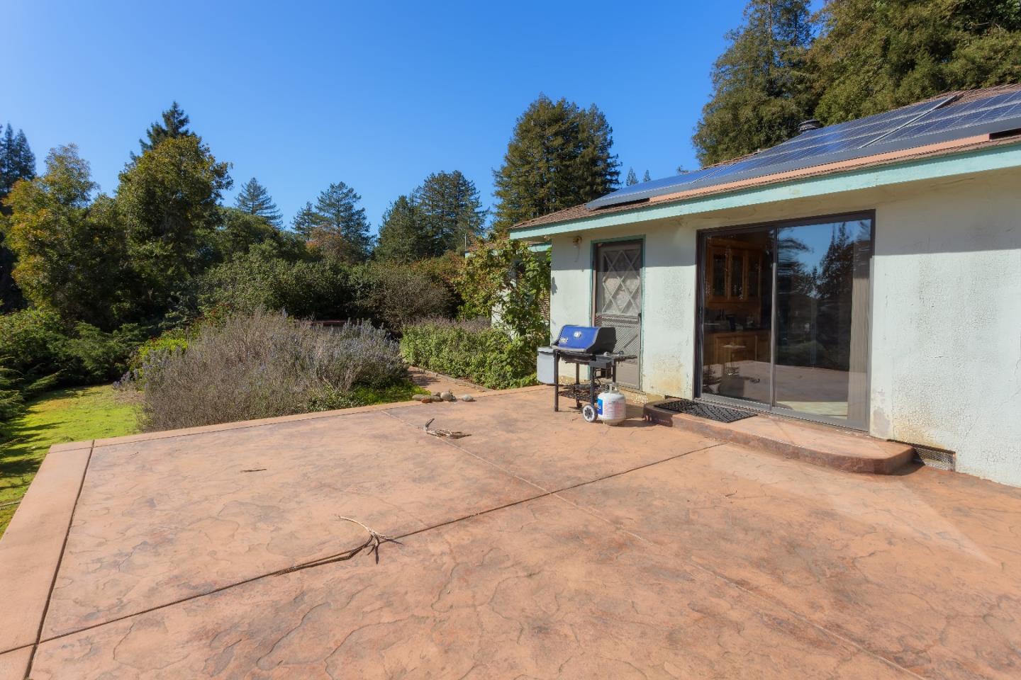 875 Calabasas Road Watsonville, CA 95076 - Photo 10 of 34 a backyard of a house with yard and outdoor seating