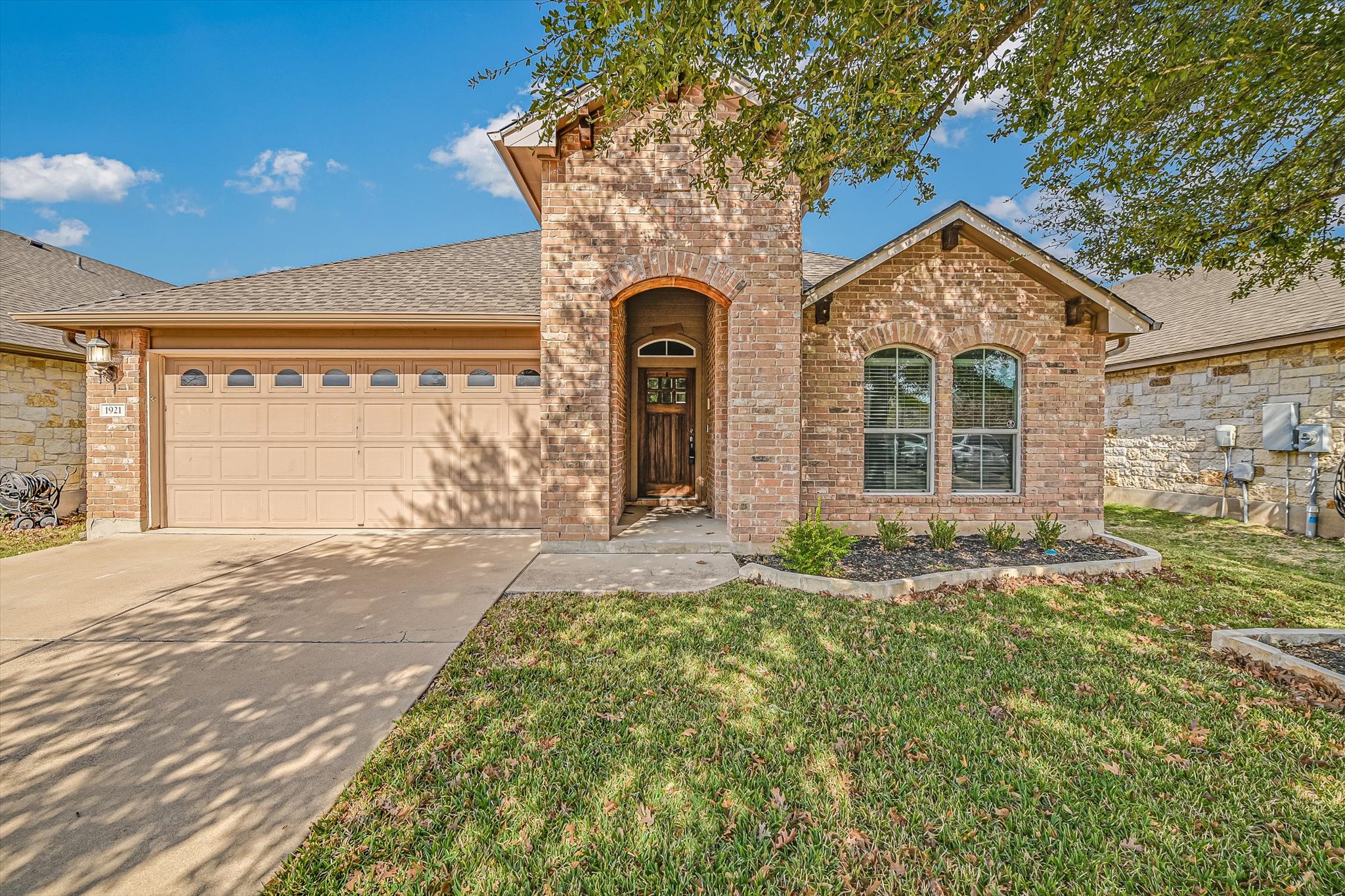 1921 Conn Creek Road Cedar Park, TX 78613 - Photo 2 of 40 a front view of a house with garden