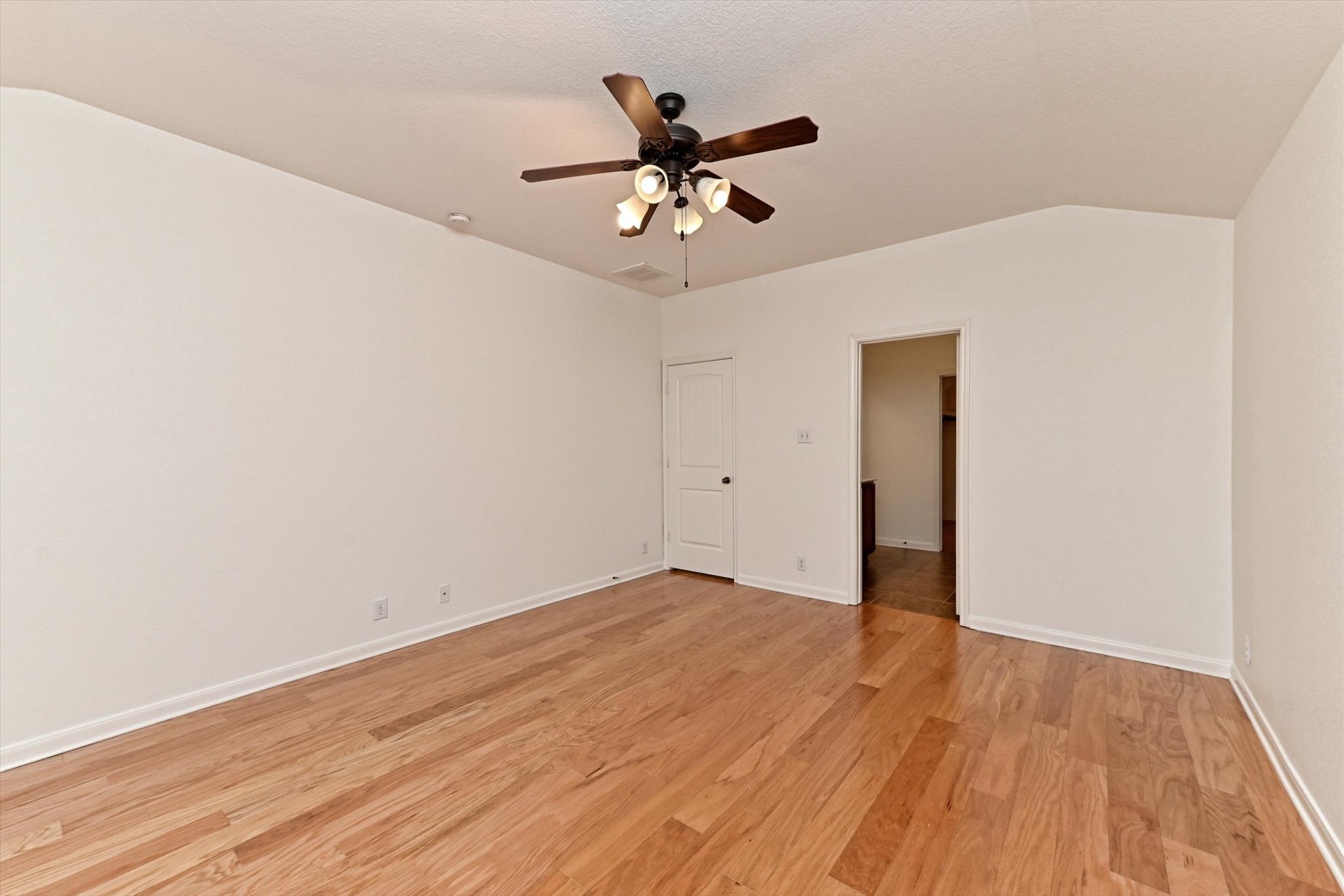 1921 Conn Creek Road Cedar Park, TX 78613 - Photo 22 of 40 an empty room with wooden floor closet and ceiling fan