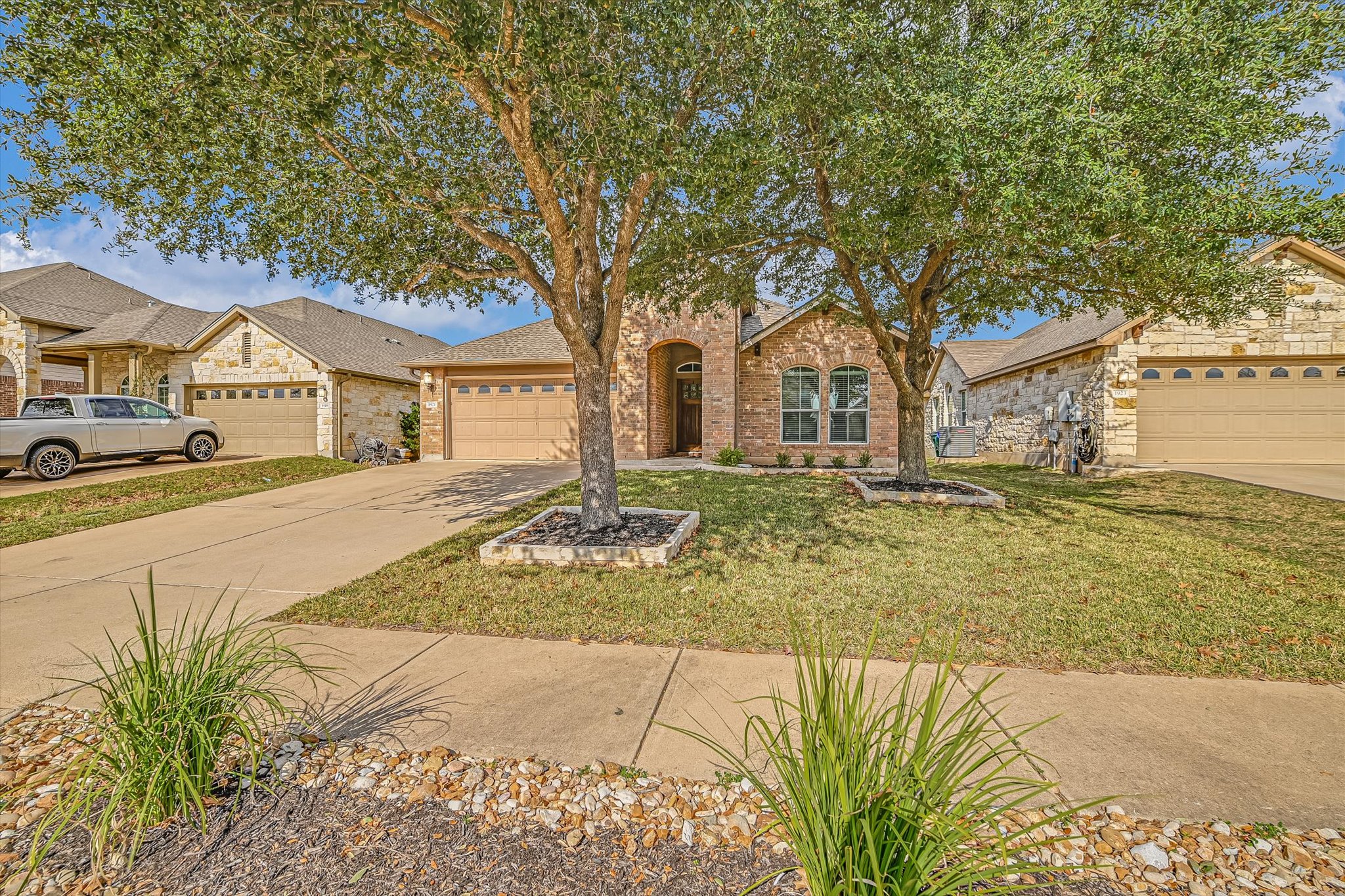 1921 Conn Creek Road Cedar Park, TX 78613 - Photo 37 of 40 a front view of a house with a yard and trees