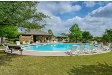 a view of a lake with a house in the background