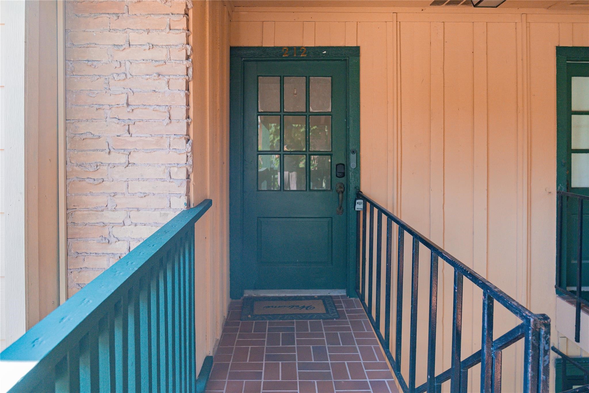 8223 Kingsbrook Road, Unit 212 Houston, TX 77024 - Photo 8 of 10 a view of wooden balcony