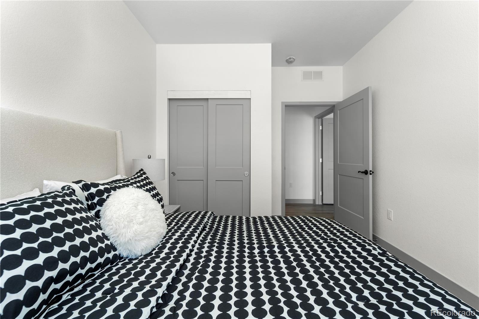 18645 Stroh Road, Unit 2208 Parker, CO 80134 - Photo 23 of 32 a bathroom with a black white checkered floor