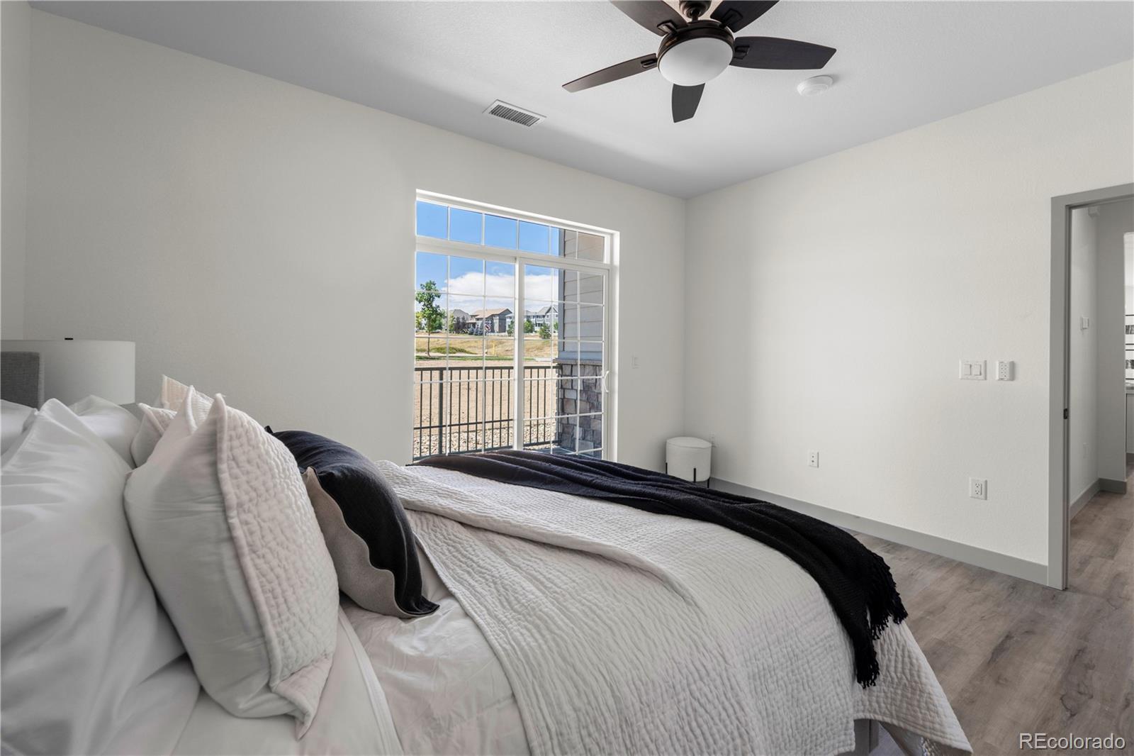 18645 Stroh Road, Unit 2208 Parker, CO 80134 - Photo 26 of 32 a bedroom with a bed and window