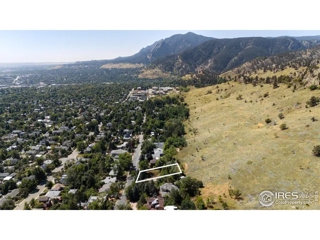 a open area with a yard in back