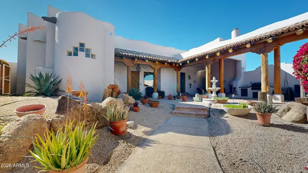 a swimming pool with outdoor seating