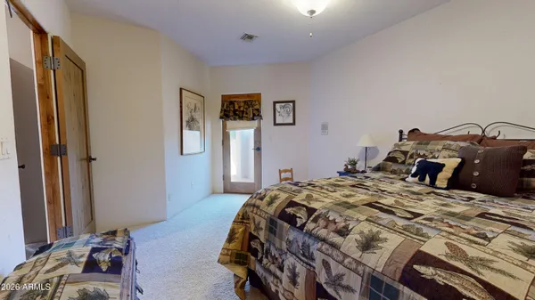 a bathroom with a granite countertop bathtub and toilet
