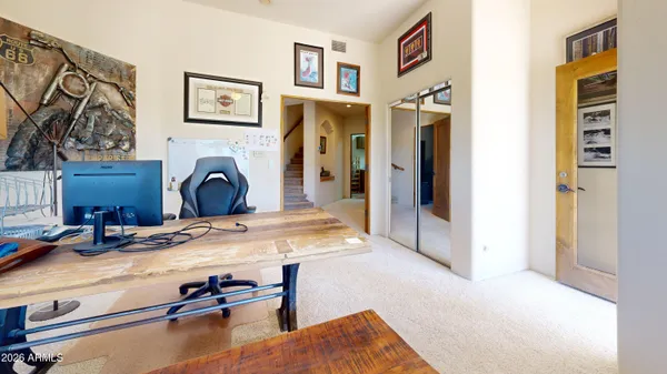 a bedroom with a bed and cabinets