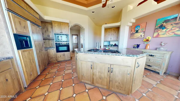 a kitchen with a sink stove and refrigerator