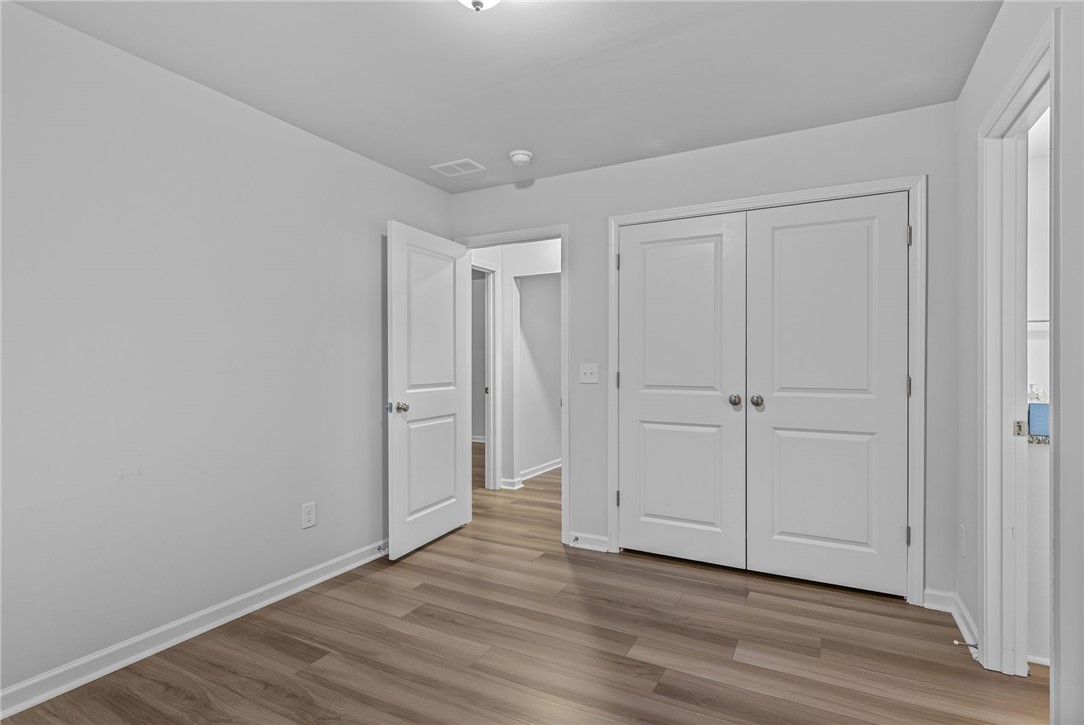 24 Chalet Court Anderson, SC 29621 - Photo 22 of 39 This bright room features durable flooring, offering versatile living space.