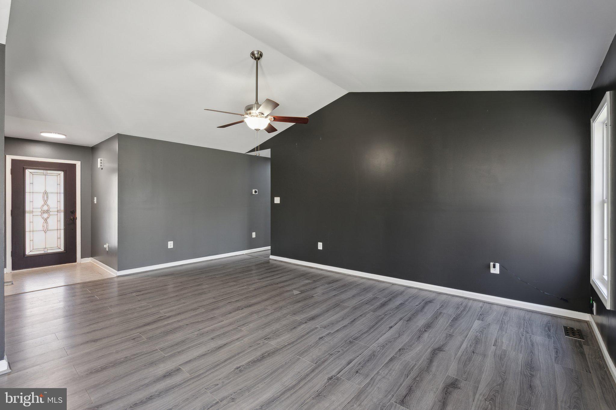 6169 Vance Lane Culpeper, VA 22701 - Photo 12 of 44 a view of an empty room with wooden floor and a window