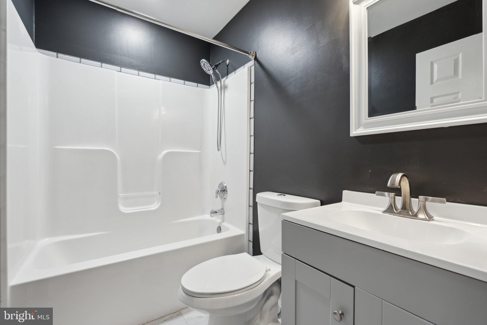 6169 Vance Lane Culpeper, VA 22701 - Photo 16 of 44 a bathroom with a sink a toilet and shower