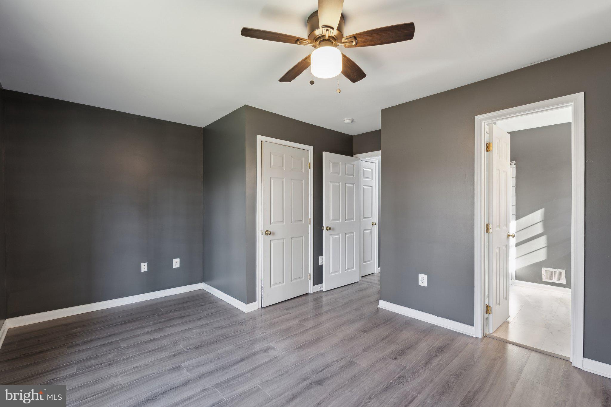 6169 Vance Lane Culpeper, VA 22701 - Photo 19 of 44 wooden floor in an empty room with a window