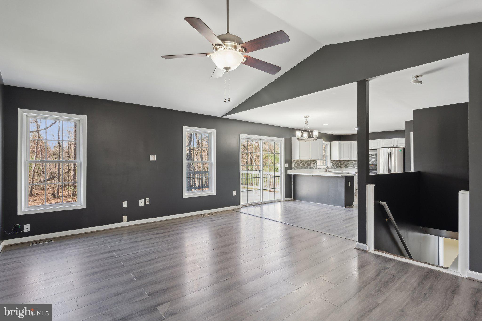 6169 Vance Lane Culpeper, VA 22701 - Photo 2 of 44 a view of an empty room with window and wooden floor