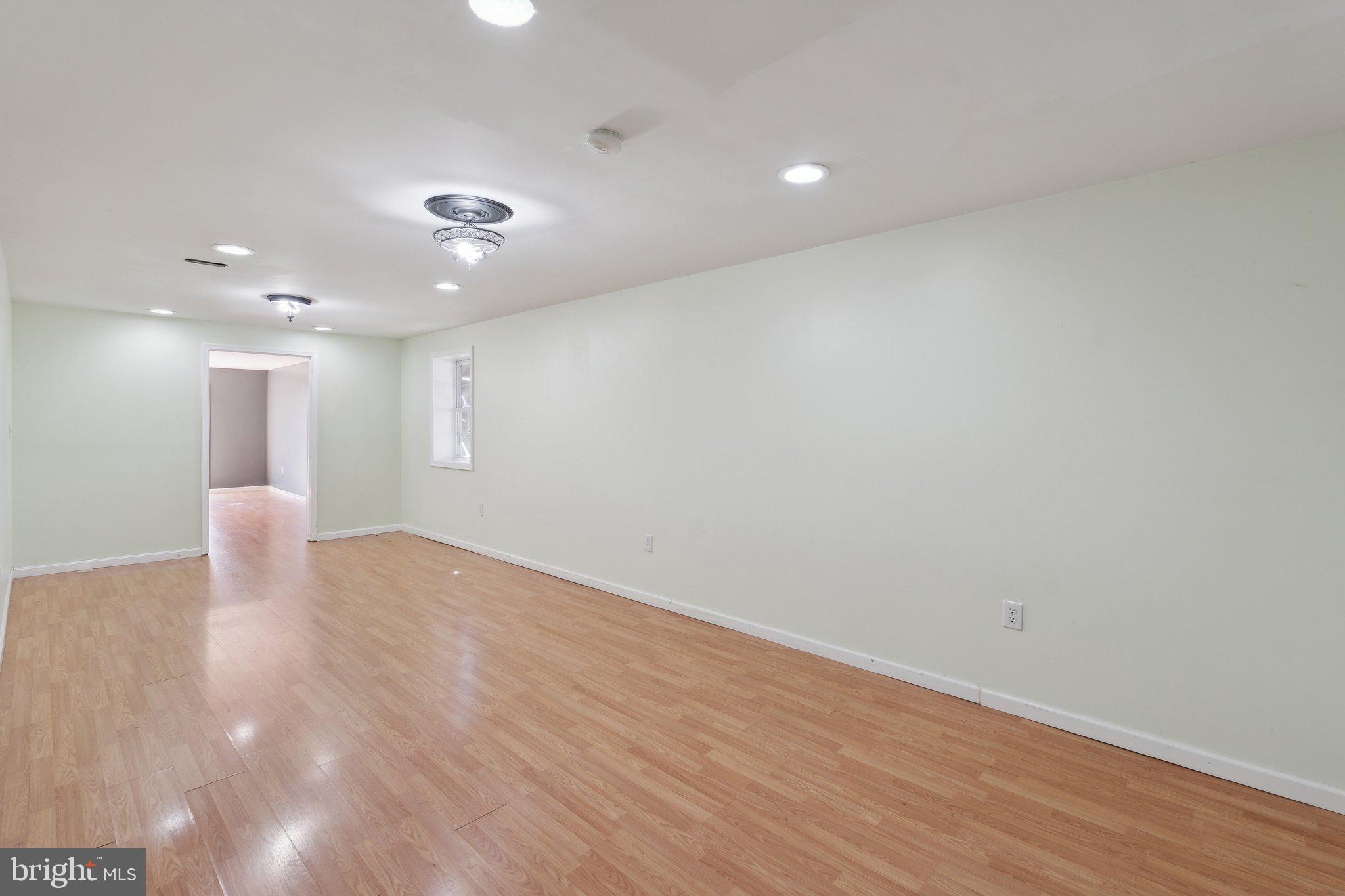 6169 Vance Lane Culpeper, VA 22701 - Photo 27 of 44 an empty room with wooden floor and windows