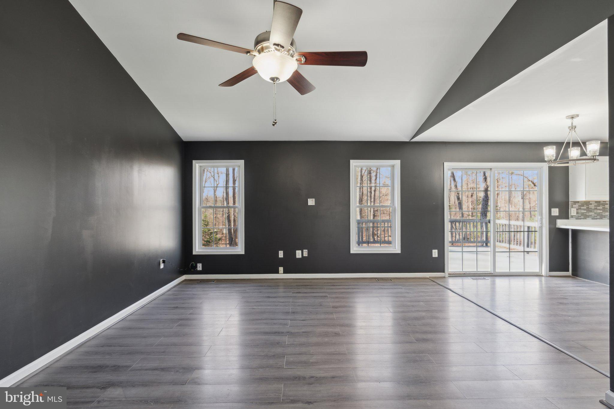 6169 Vance Lane Culpeper, VA 22701 - Photo 3 of 44 a view of an empty room with wooden floor and a window