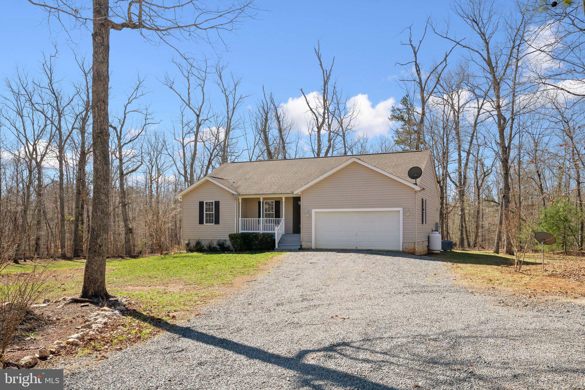 6169 Vance Lane Culpeper, VA 22701 - Photo 31 of 44 a front view of house with yard and trees around
