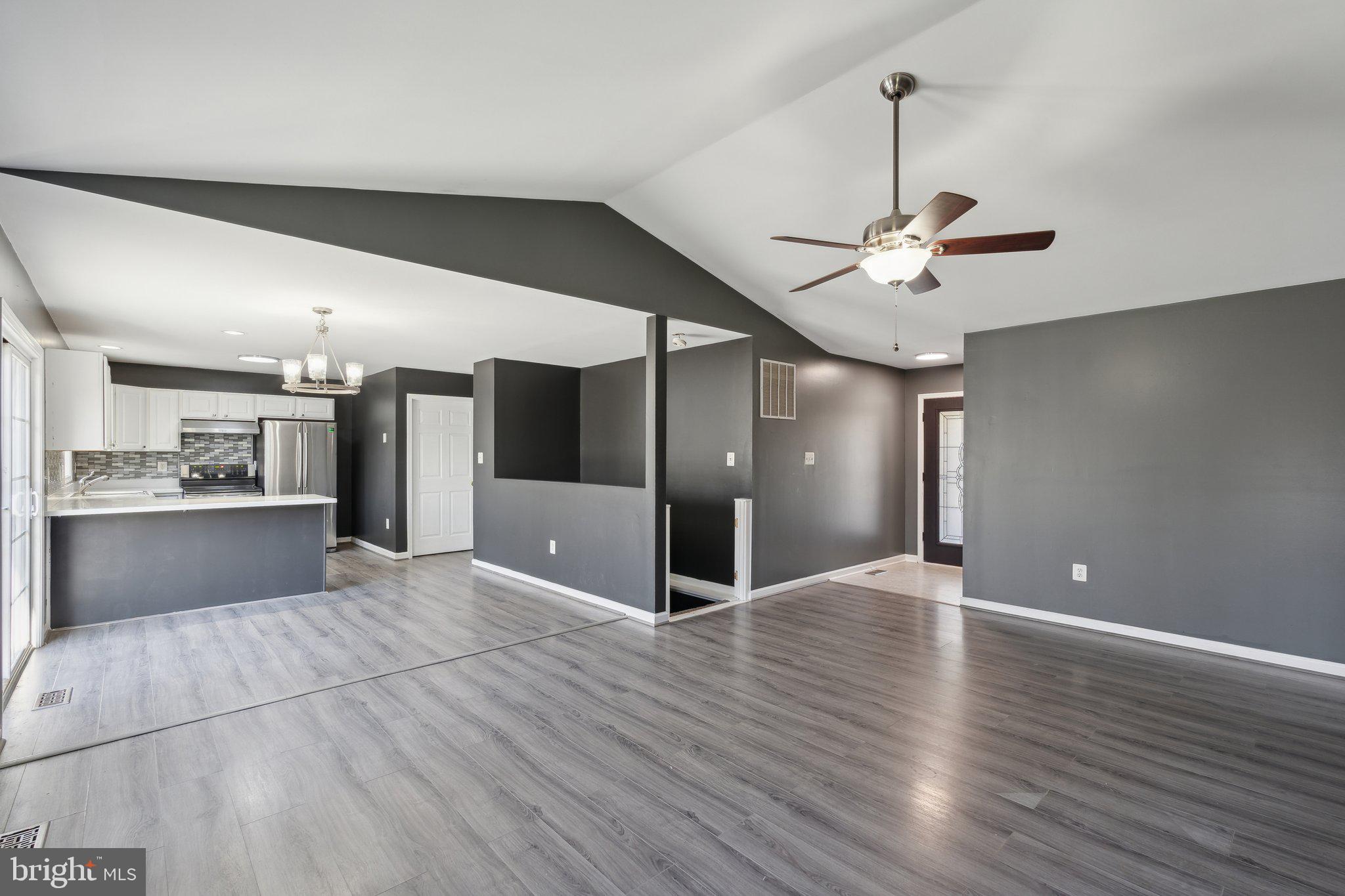 6169 Vance Lane Culpeper, VA 22701 - Photo 4 of 44 a view of an empty room with a kitchen