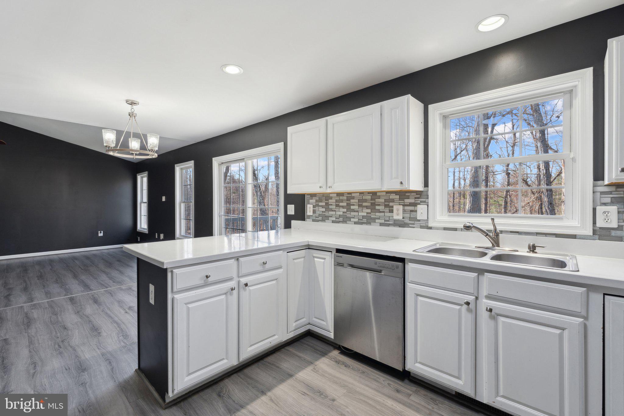 6169 Vance Lane Culpeper, VA 22701 - Photo 9 of 44 a kitchen with a sink cabinets and window