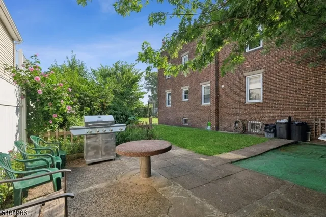 a view of a backyard with plants and garden