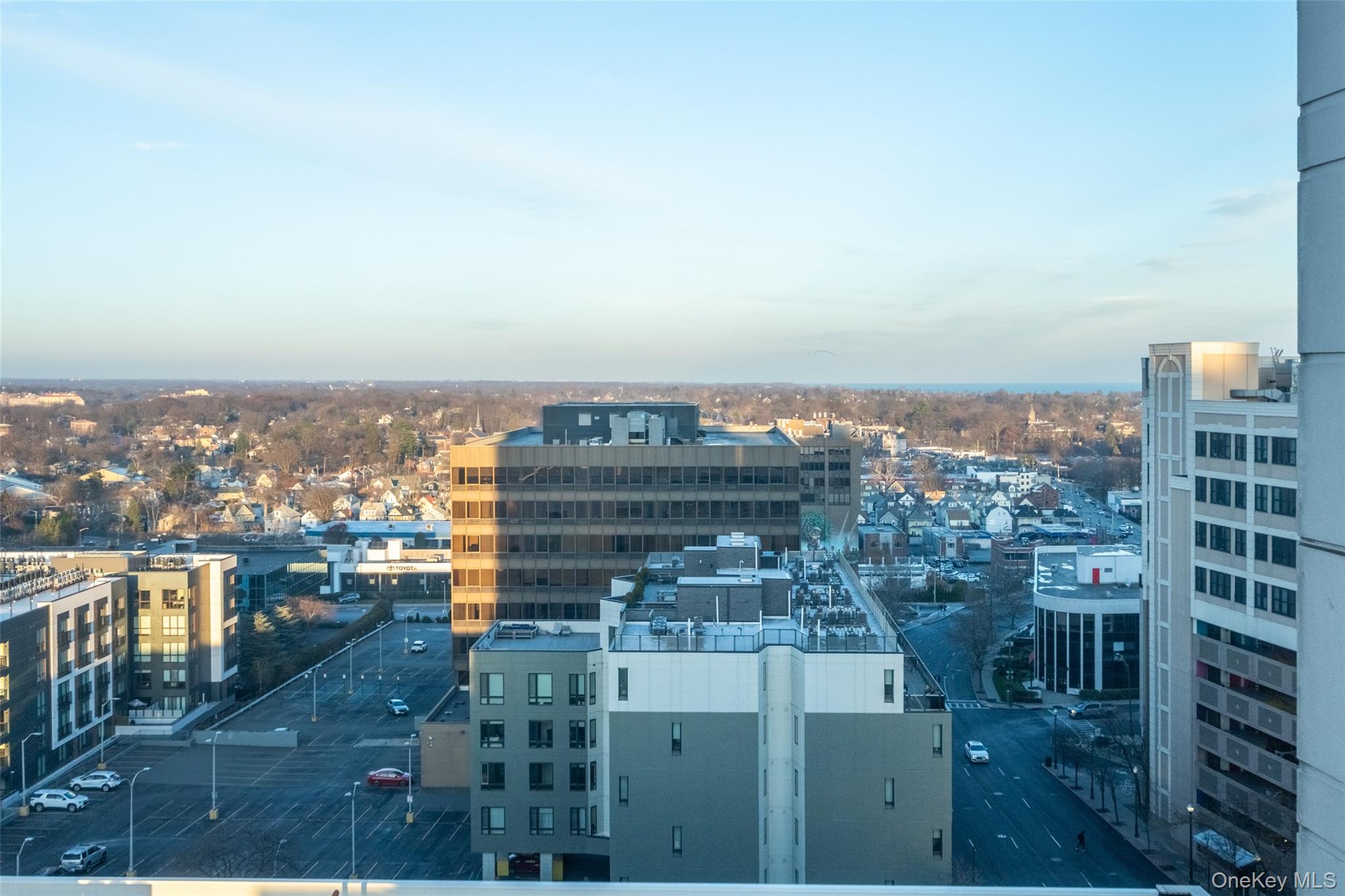 175 Huguenot Street, Unit 1401 New Rochelle, NY 10801 - Photo 21 of 29 a view of a city with tall buildings