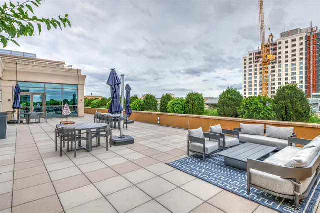 a view of a building with a table and chairs