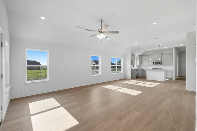 a view of a kitchen with a sink and a window