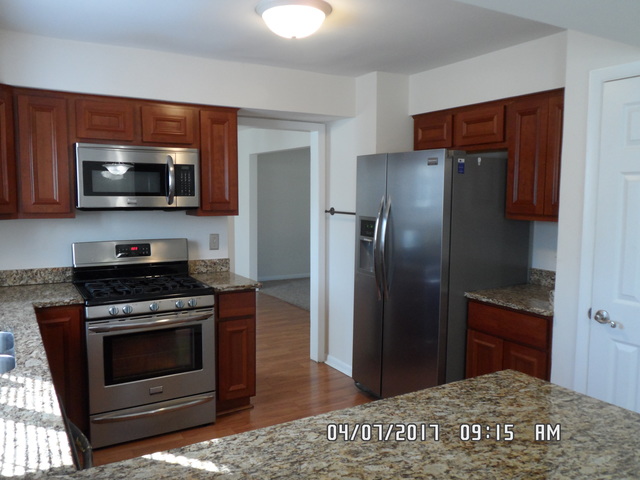 20641 Promethian Way Olympia Fields, IL 60461 - Photo 6 of 12 a kitchen with a stove microwave and refrigerator