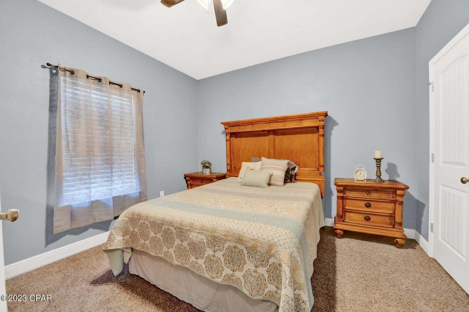 622 Cornelia Street Freeport, FL 32439 - Photo 19 of 43 a bedroom with a bed and a window